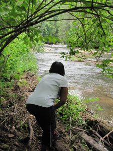 Person looking at the river